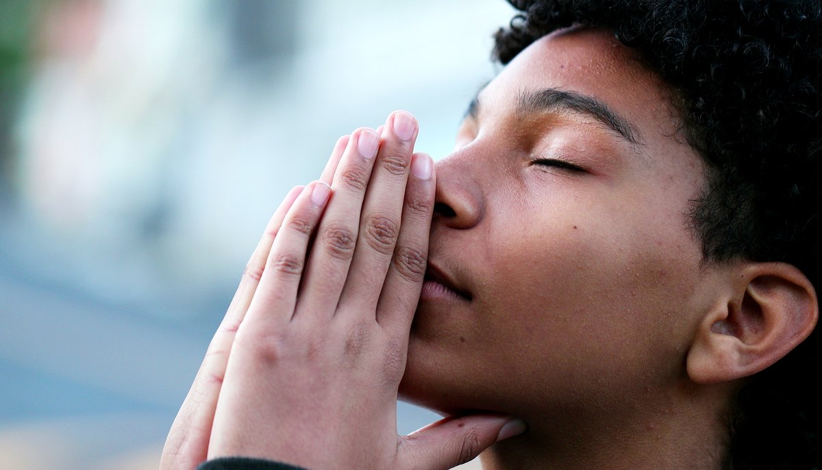 Young man praying